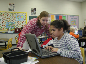 GTL student assisting student in classroom.